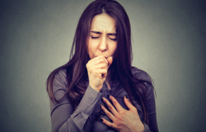 Young-woman-coughing,-photocredit-pathdoc-on-AdobeStock-640